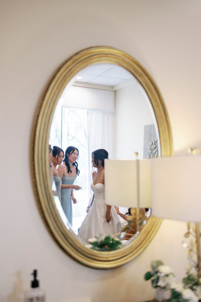 bride getting ready with her bridesmaids church wedding day