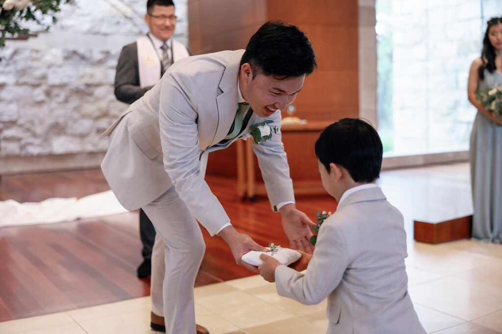 ring bearer brings rings to groom at church wedding