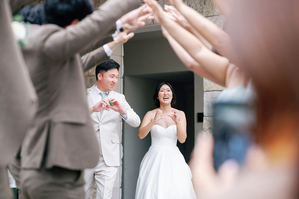 entrance into reception bride and groom smile 