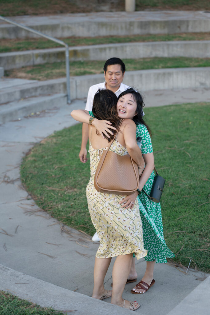 Two women hugging after proposal at Dana Point.