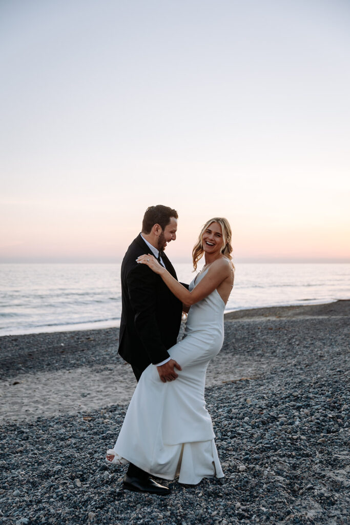 bride and groom golden hour photos on beach