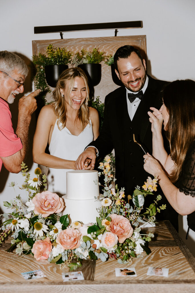 bride and groom during cake cutting ceremony