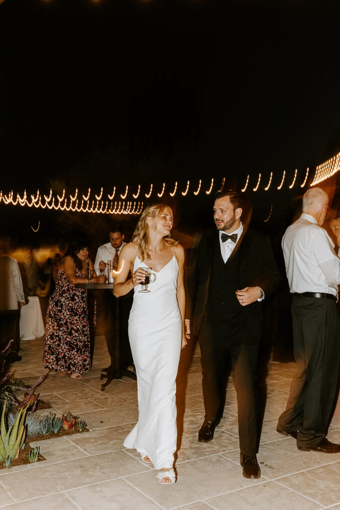 bride and groom enjoying some time outside during reception