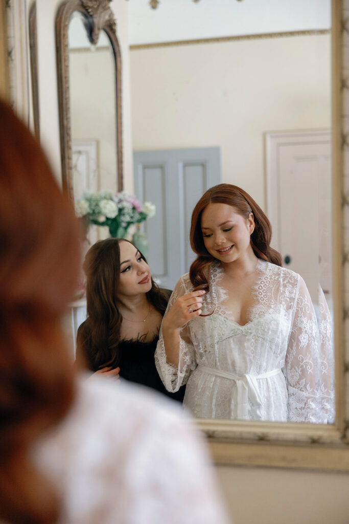 bride with bridesmaid before getting ready