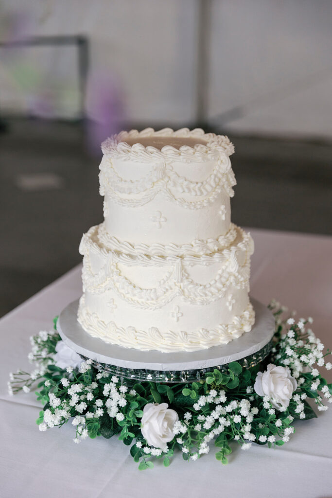 two-tiered vintage-inspired white wedding cake