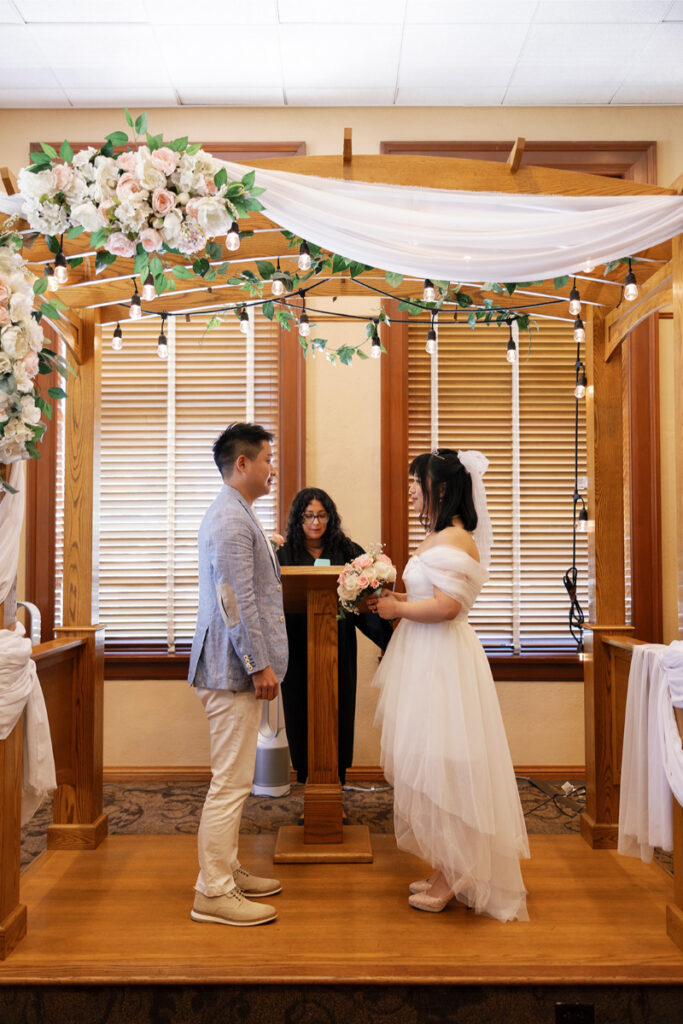 Bride and groom exchange vows in Old Orange County Courthouse. 