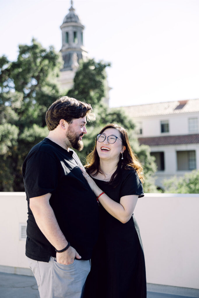 Sharing a laugh, the couple stands in front of Pasadena City Hal during their elopement.